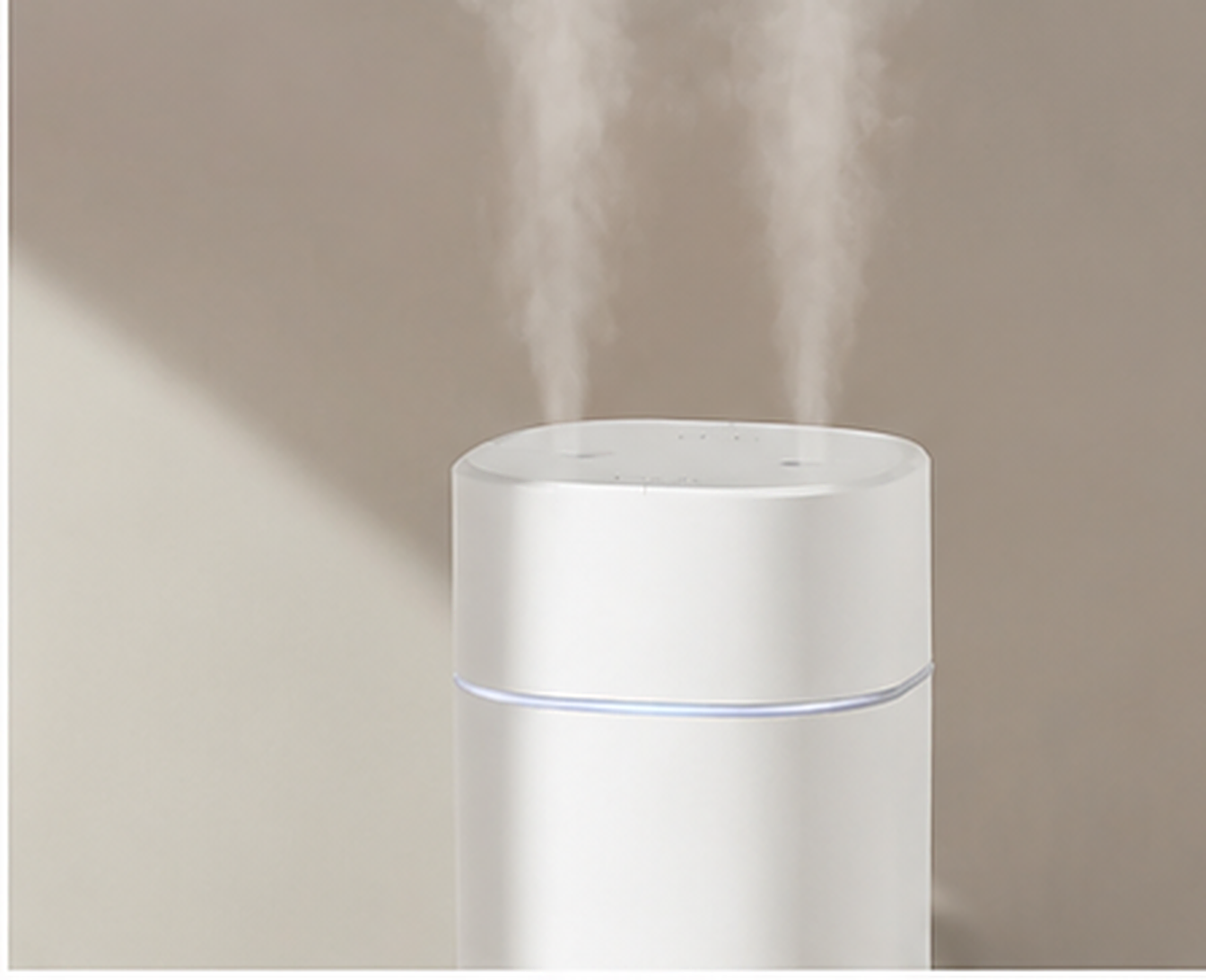 Close-up of the humidifier's twin mist vents with ultra-fine cool mist rising.
